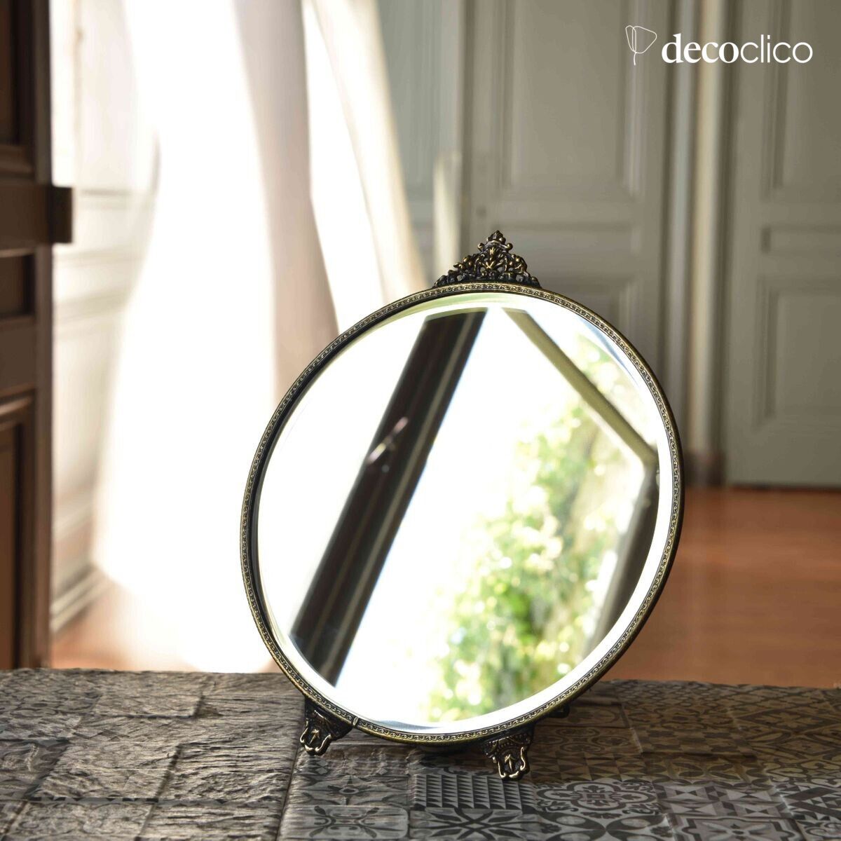 Antique brass-colored metal mirror