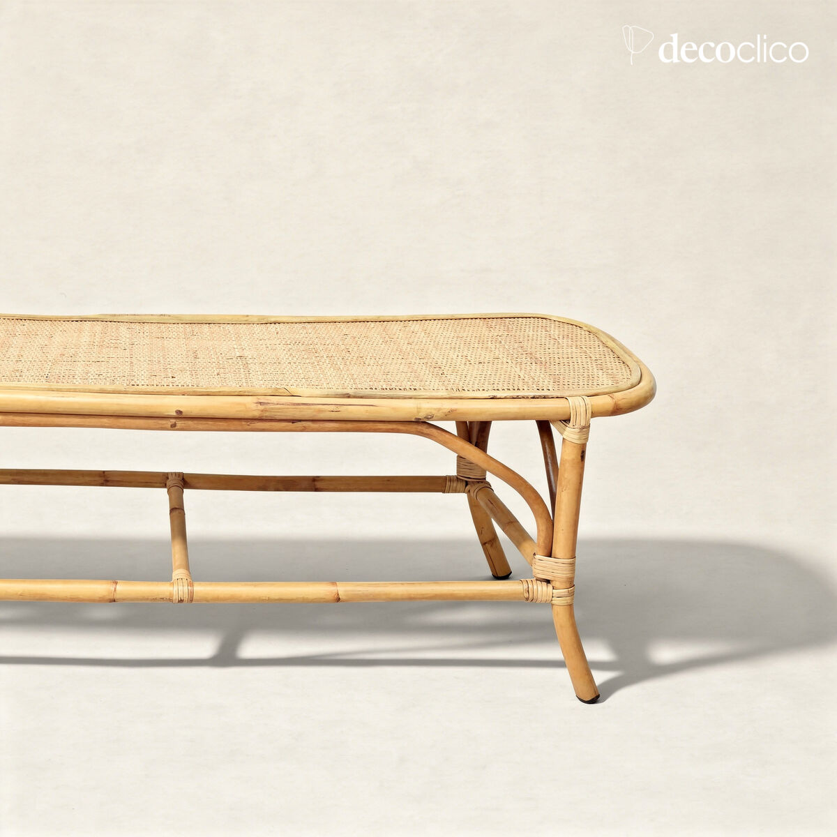 Bed end bench with rounded corners in woven natural rattan Pavone