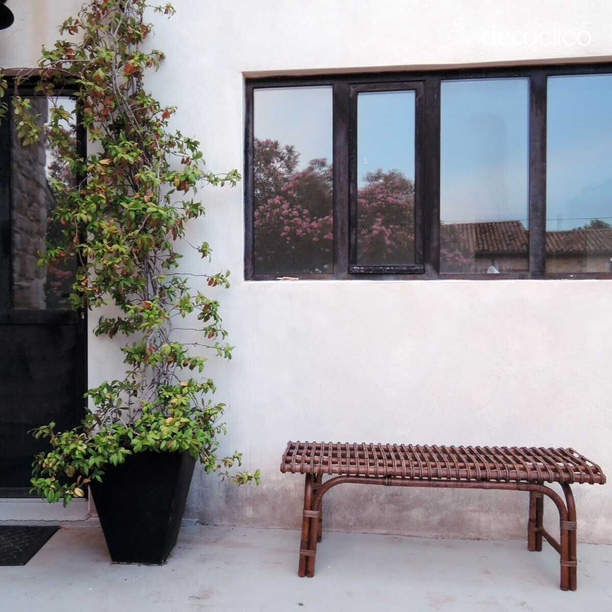 Bench for the end of a bed in woven natural rattan