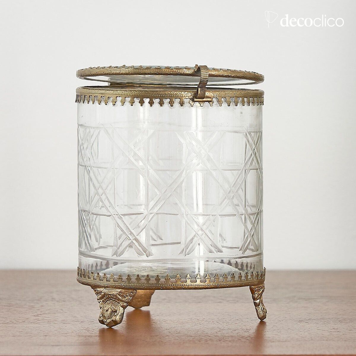 Caja de joyas redonda de metal dorado mate y cristal grabado