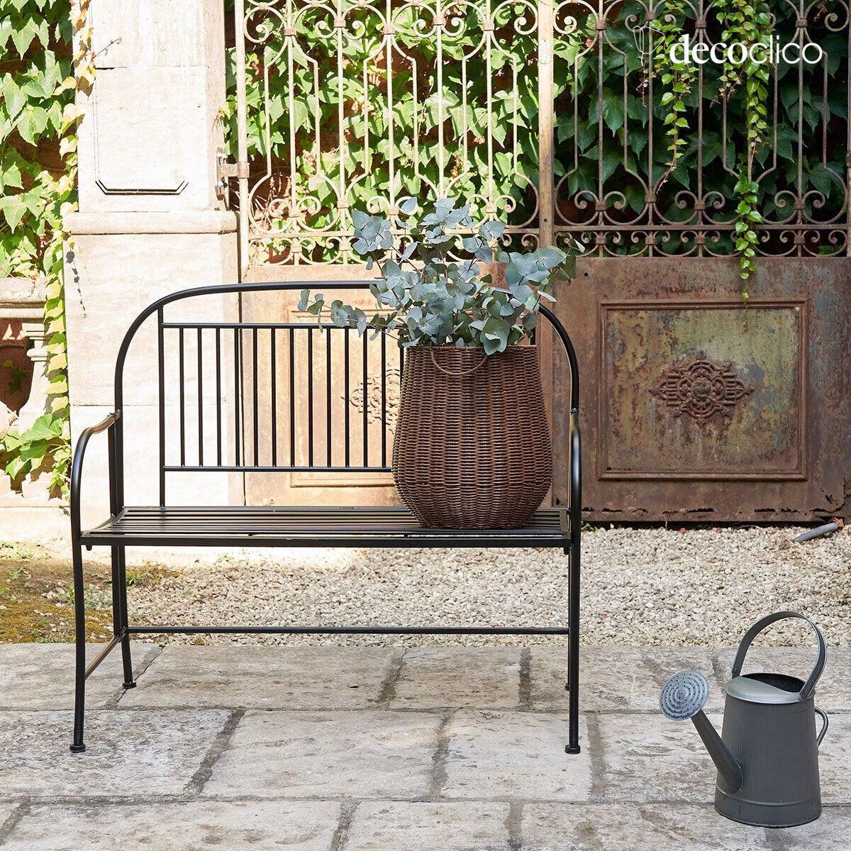 Folding black wrought iron bench with armrests