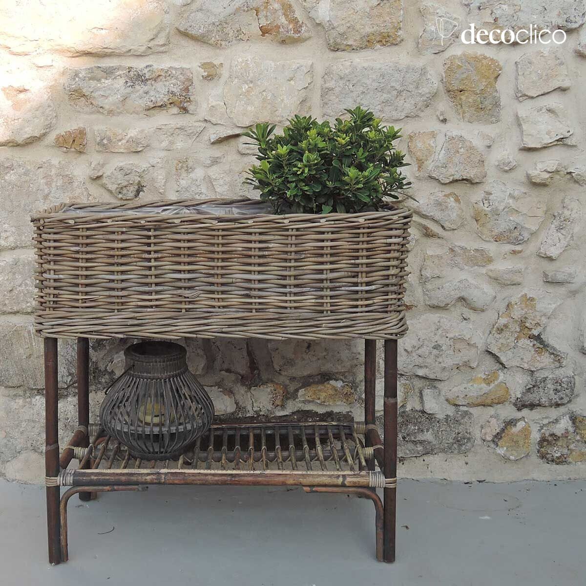 Free-standing planter in woven natural rattan