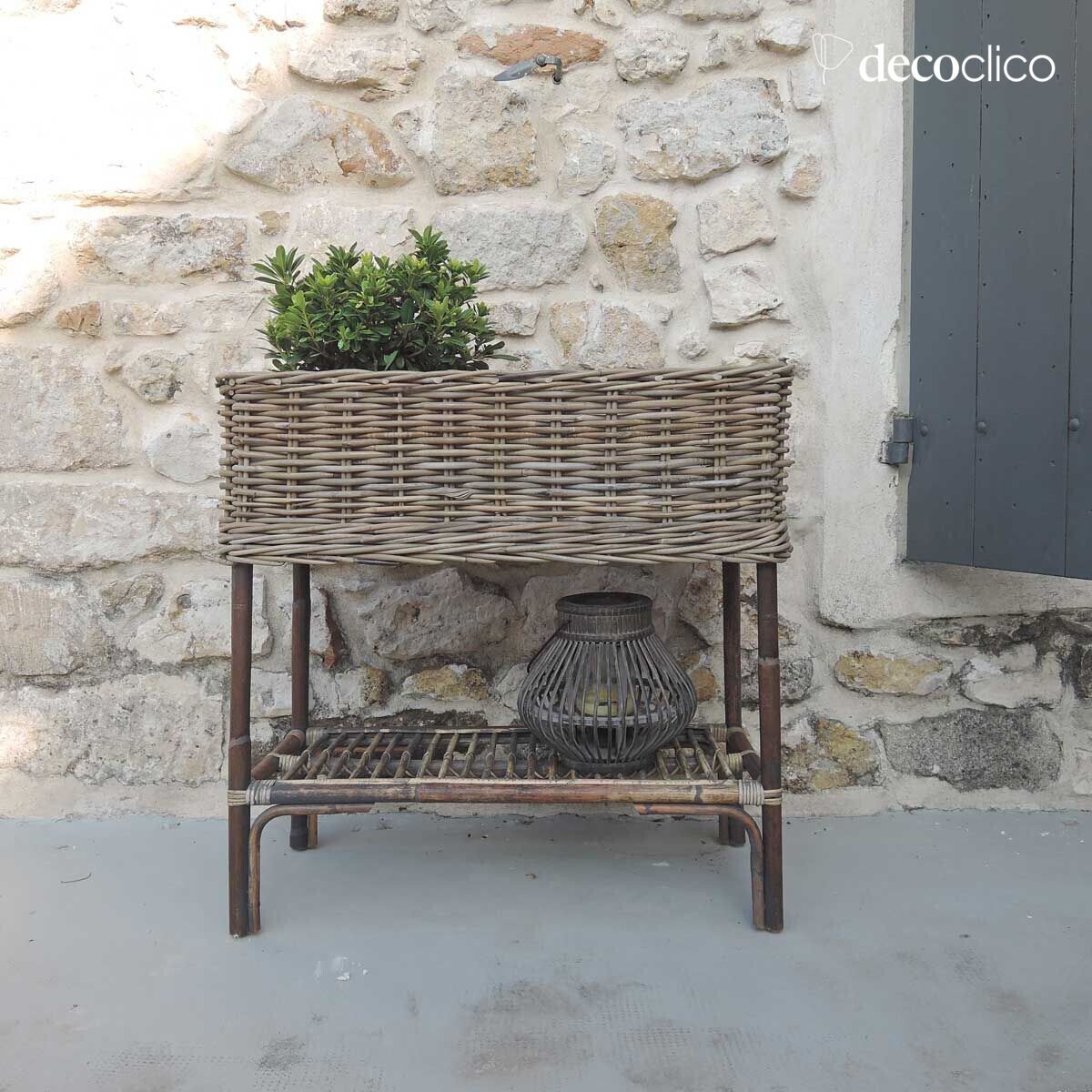 Free-standing planter in woven natural rattan