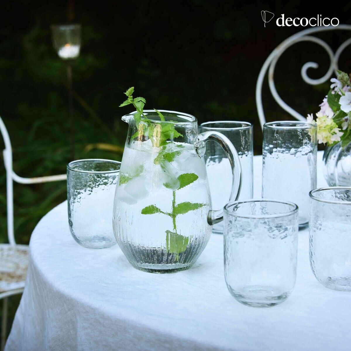Jug carafe in transparent dappled glass with ribbed base