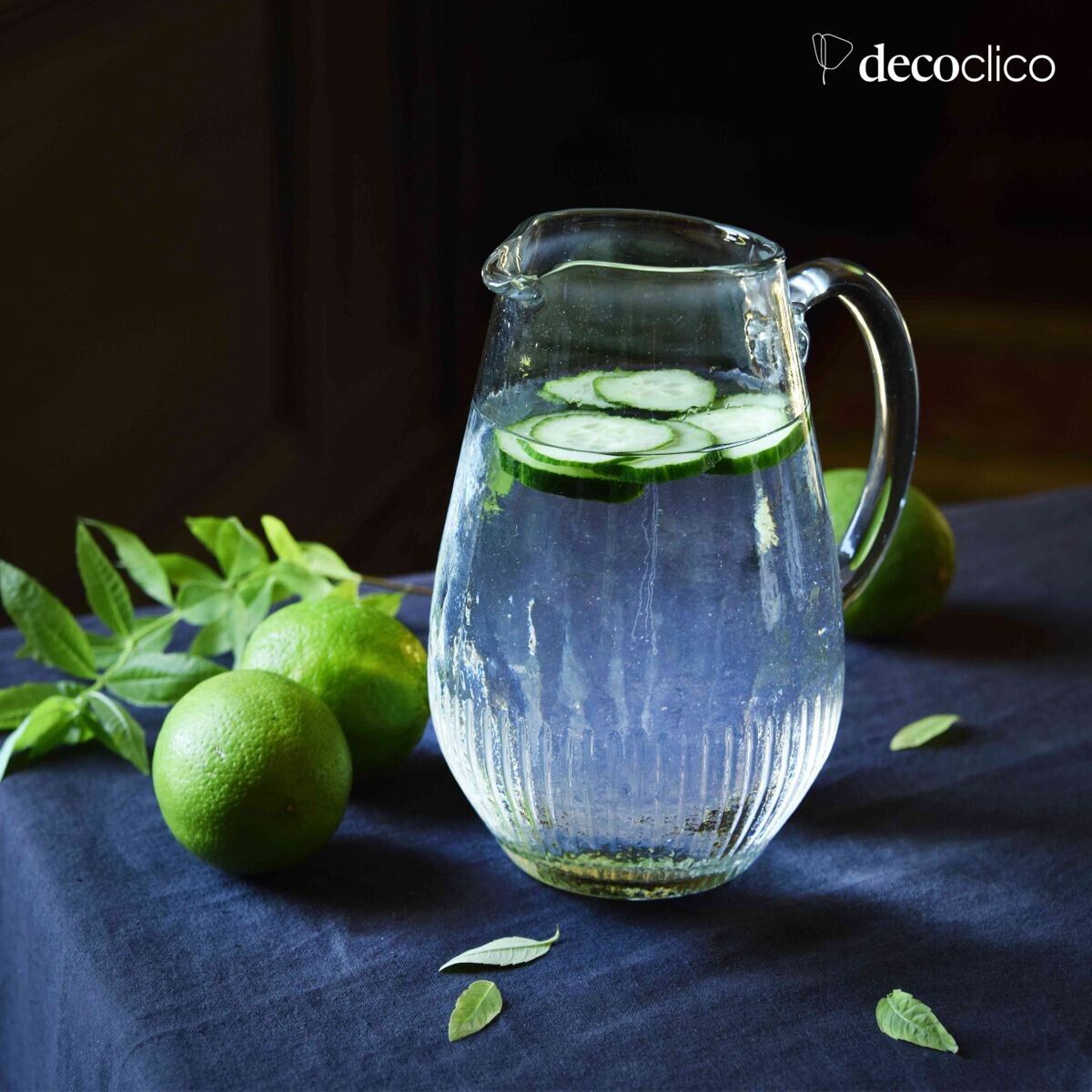 Jug carafe in transparent dappled glass with ribbed base