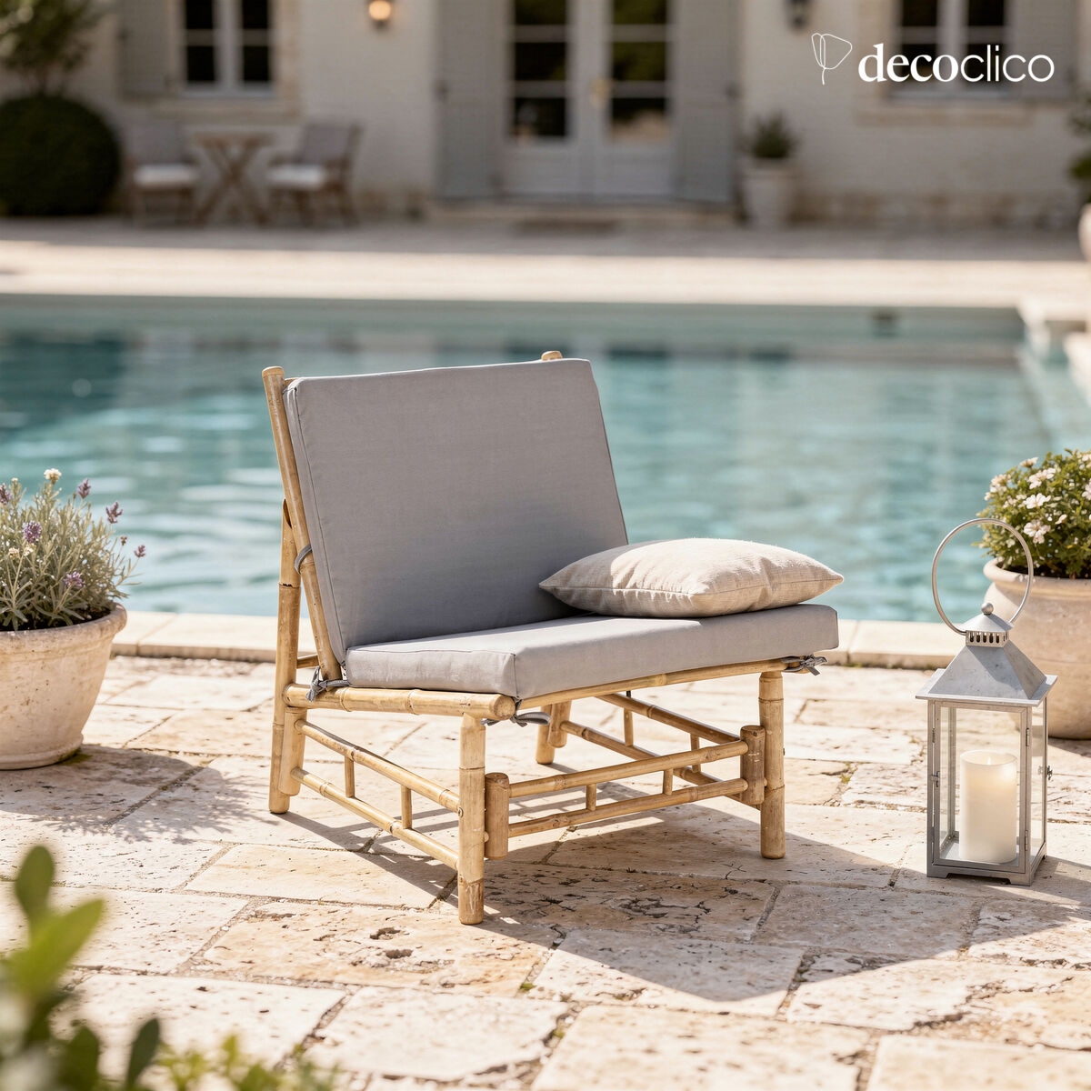 Low lounge chair in natural bamboo with gray outdoor cushion Taman