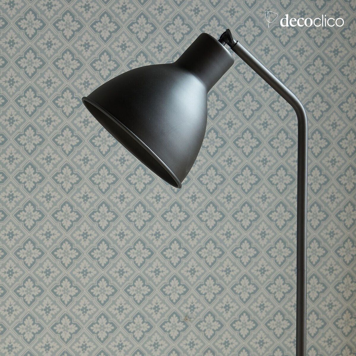 Metal lamp post with a matt black finish and white marble base