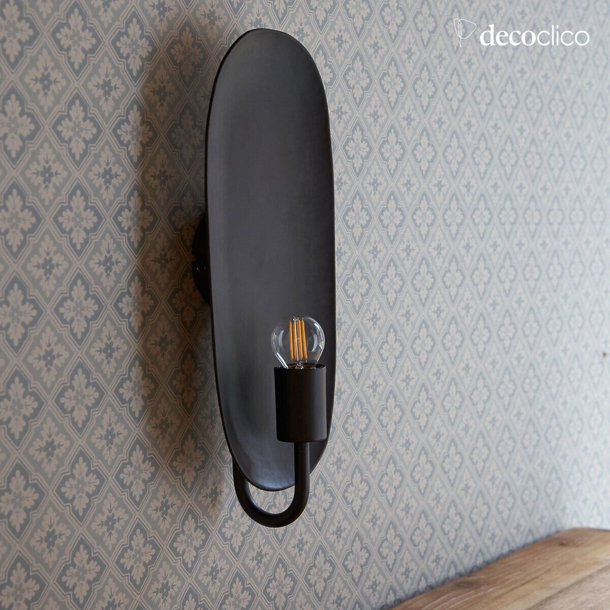 Wall sconce in the style of a candleholder, in metal with a matt black finish